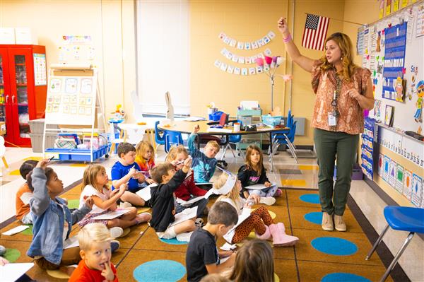 Students inside their classrooms learning. 